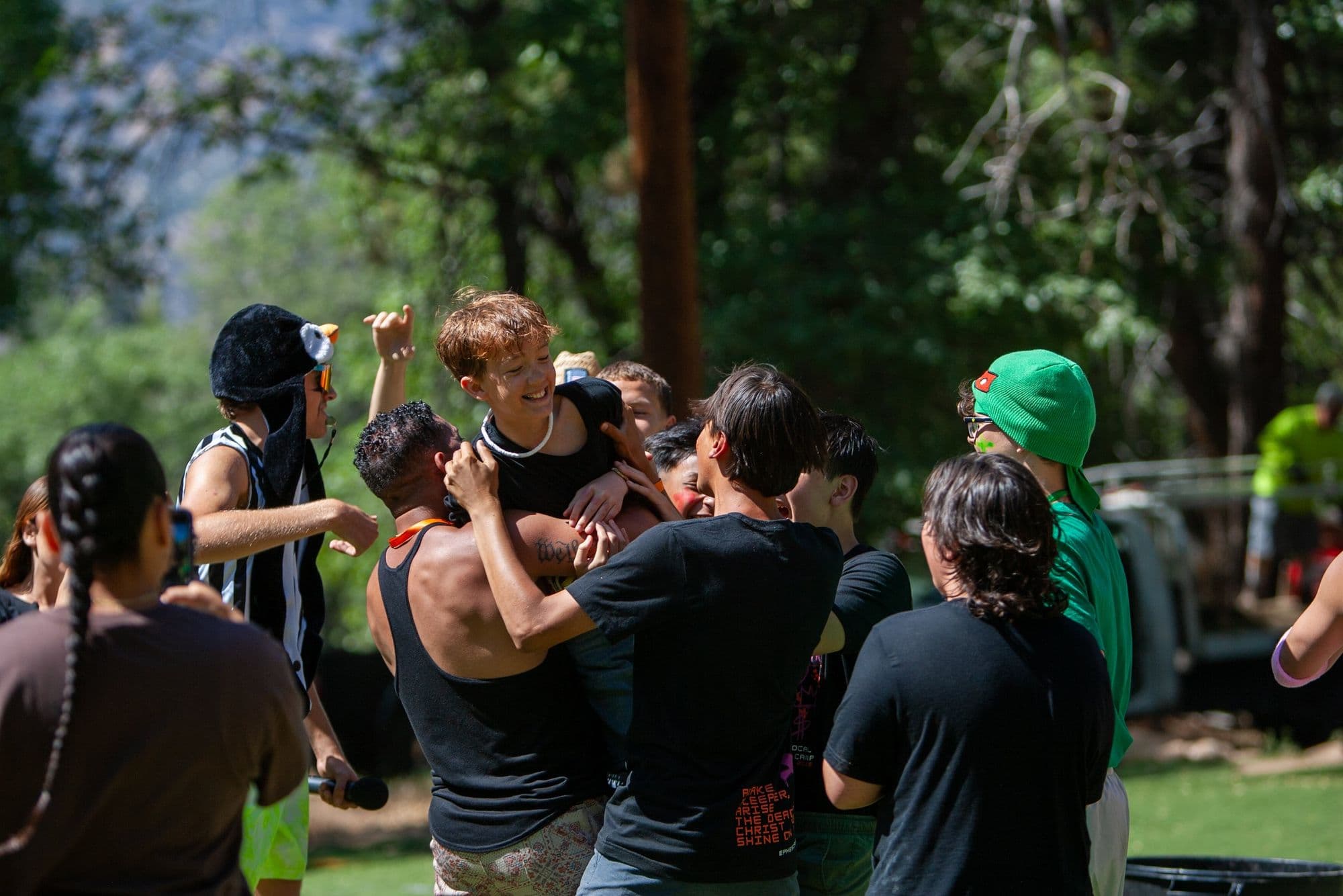 Campers celebrating together during a team game
